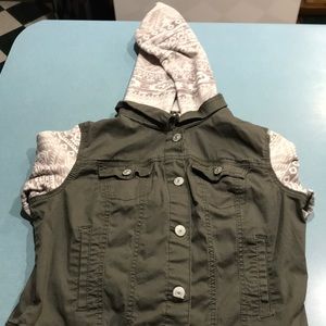 A green jacket with different patterns.